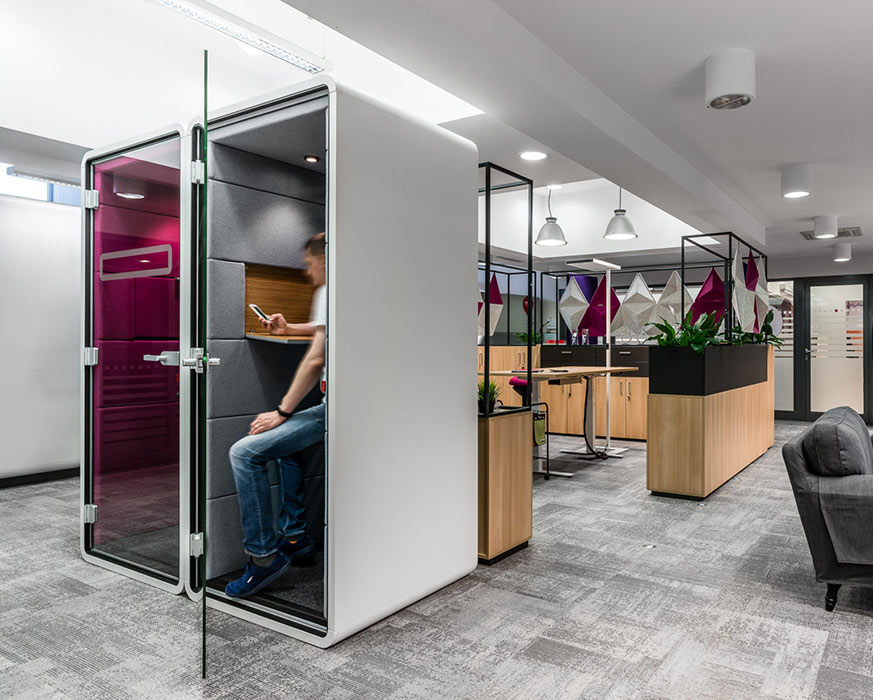 Office pods in open plan office.