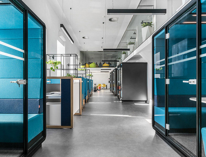 Office pods in open plan workspace
