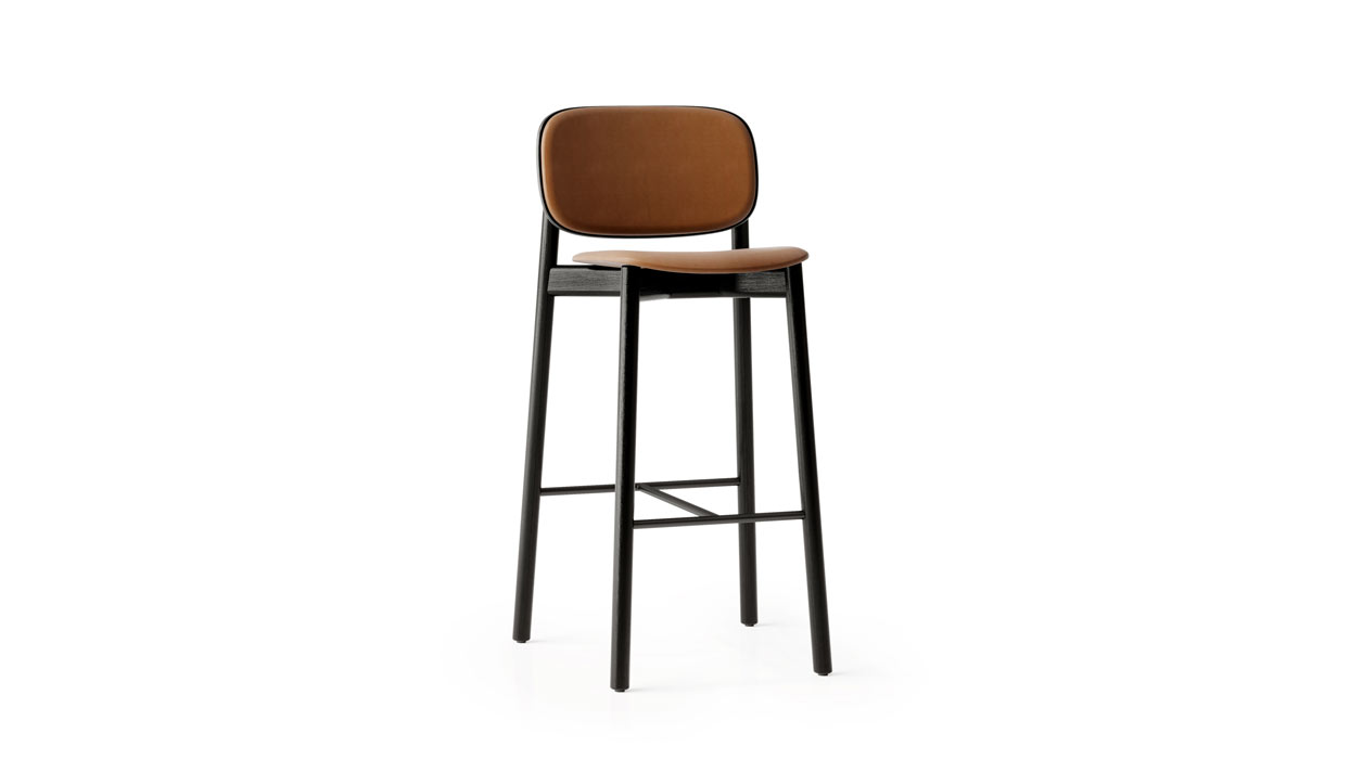 Kitt stool with upholstered back and seat pad.