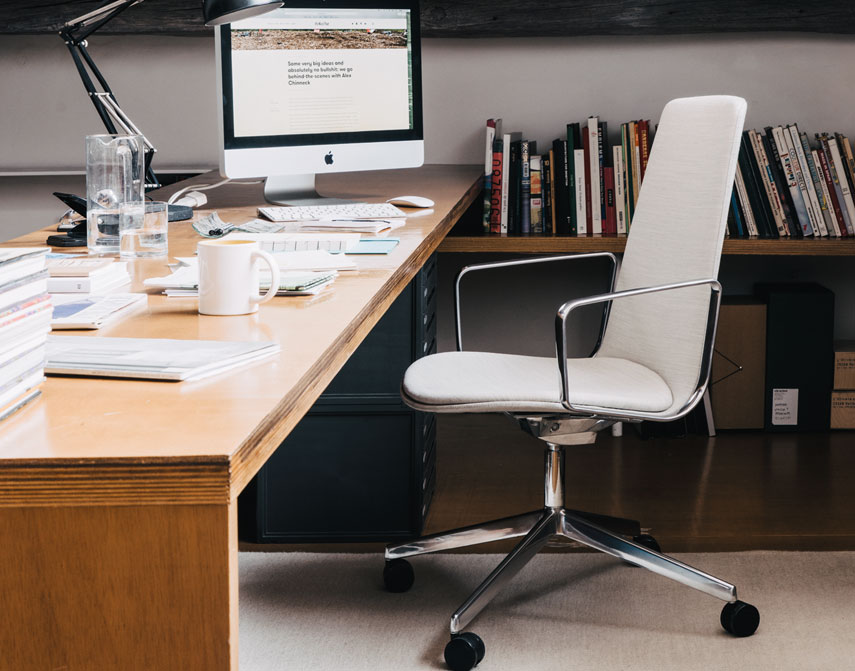 High backed Lottus arm chair at a desk