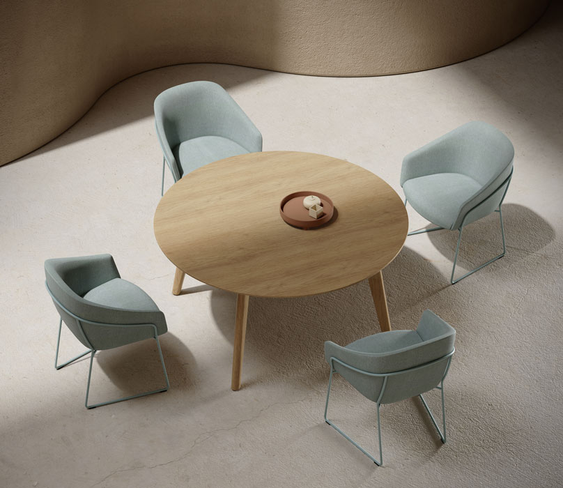 Niko round meeting table with upholstered chairs. 