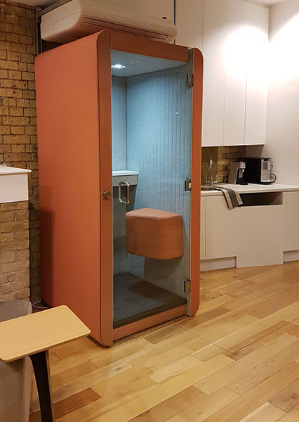 Penelope phone booth in the showroom.