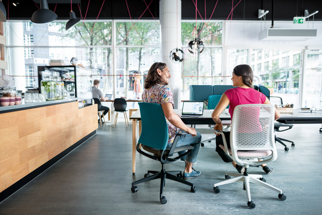 SE Motion mesh and upholstered chair in breakout agile setting