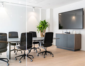 Trinetic task meeting chairs at black table.