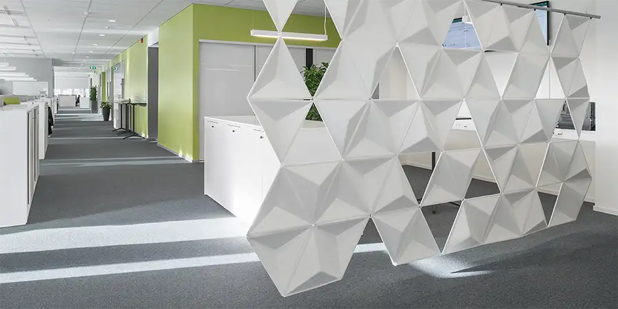 Aircone suspension panels dividing an office space