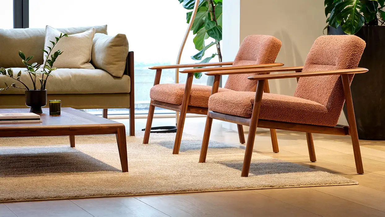 Kato armchairs upholstered in a red fabric
