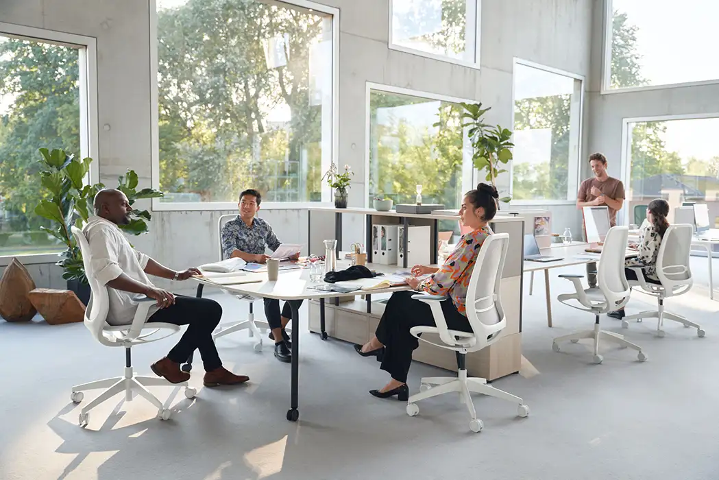 Mobile meeting table on the end of a bench desk